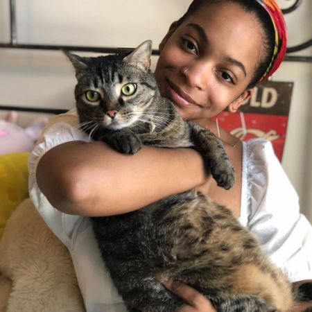 Imani Duckett posted a picture of her holding a cat.